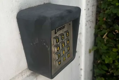 A call box handset and directory display at an apartment entrance