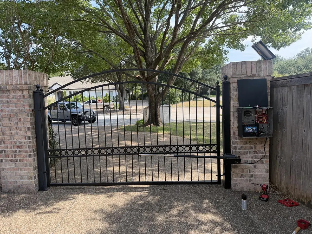 Gate and operator enclosure with tools visible.