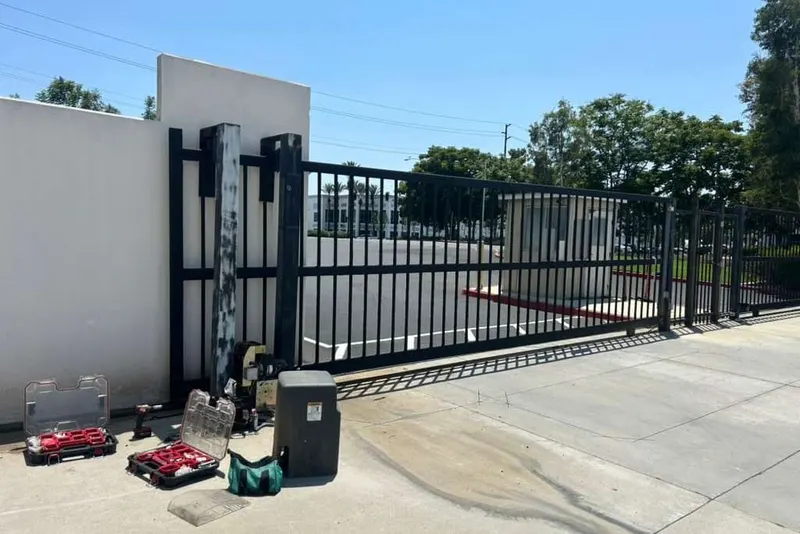 A barrier arm raised at a controlled parking entrance