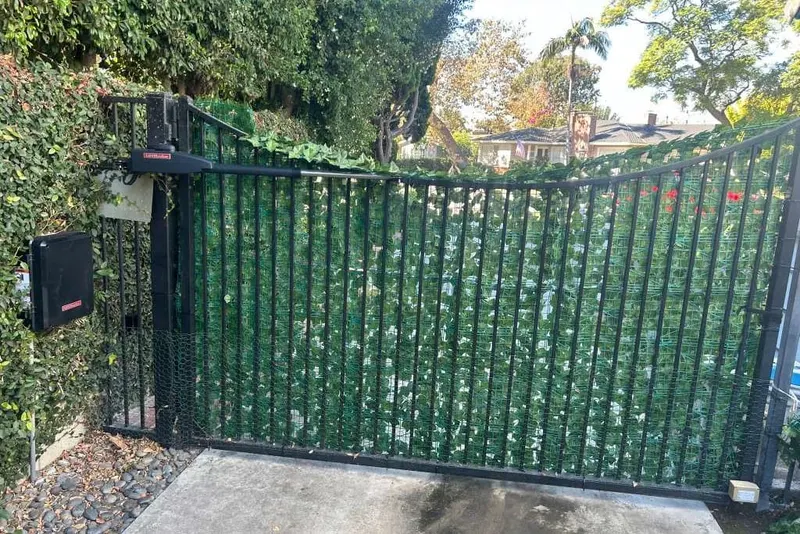 A gate released to manual operation so the driveway can be used before repair