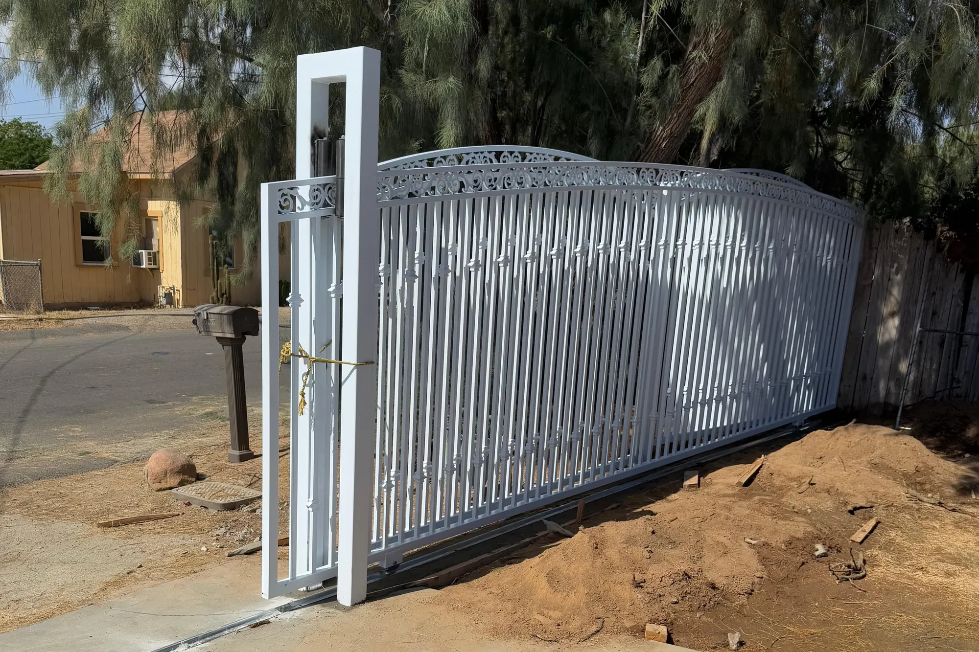 A completed sliding driveway gate in its fully open position