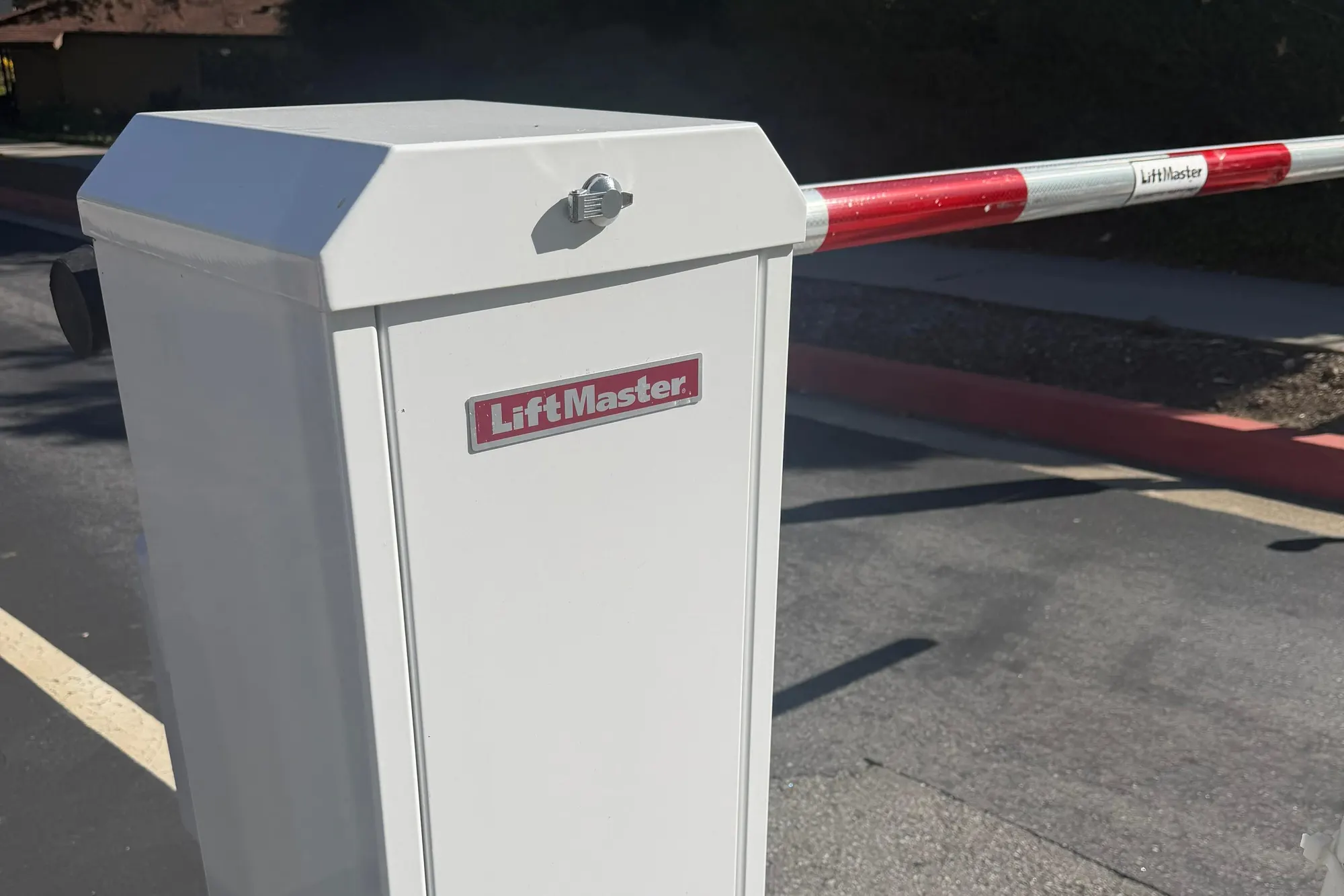 A replacement LiftMaster control board fitted into a gate operator enclosure